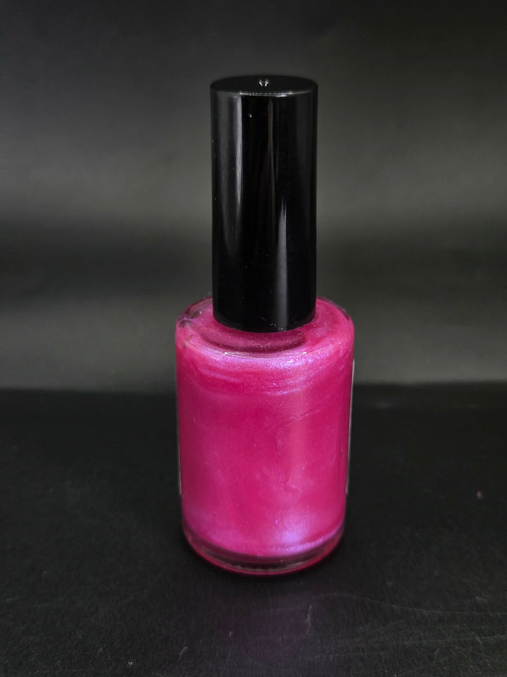 Fuchsia Eclipse by Irilune, vivid pink shimmer nail polish in a bottle with a black cap.